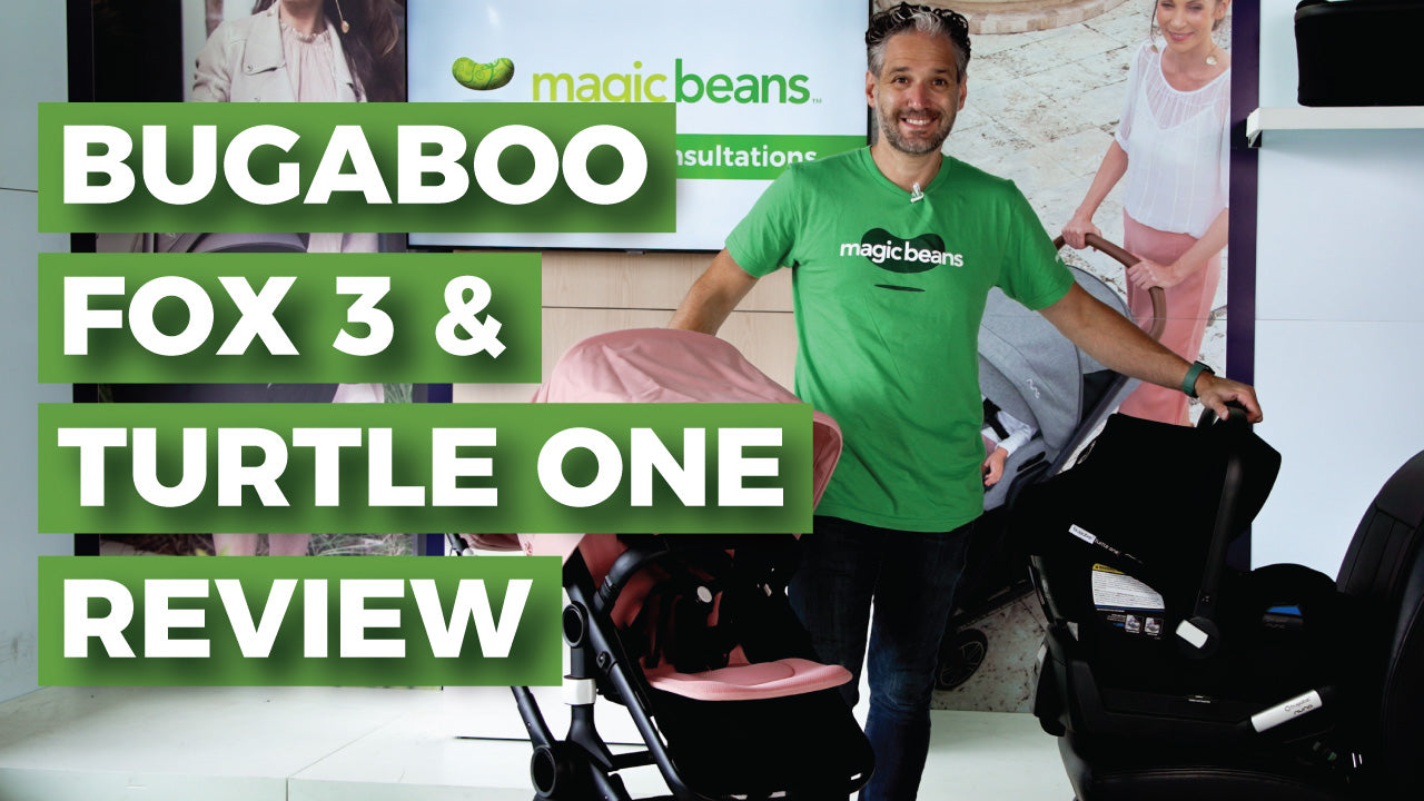 Smiling man stands in a store with the bugaboo fox 3 and bugaboo turtle one car seat beside him