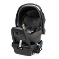 A Peg Perego Primo Viaggio 4/35 Infant Car Seat in dark grey Atmosphere sits in it's base in a studio image